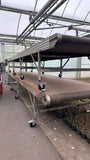 Used Visser buffer conveyor, complete with infeed conveyor and electrical control cabinet.