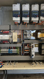 Used Visser buffer conveyor, complete with infeed conveyor and electrical control cabinet.